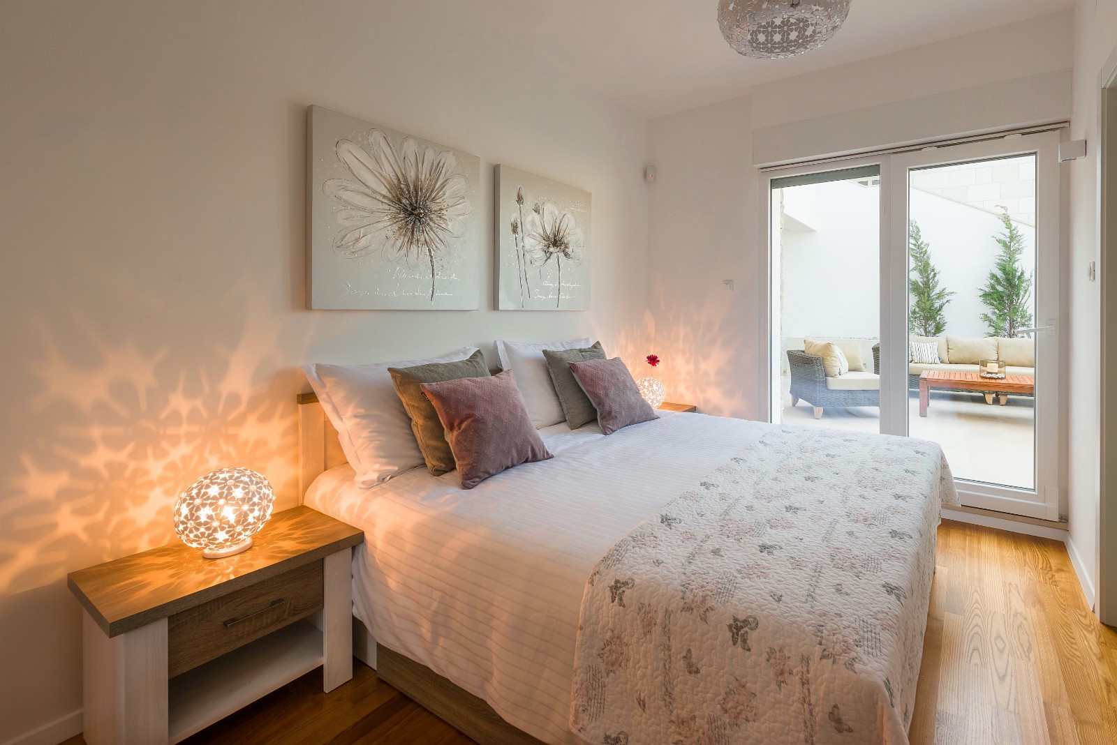 Bedroom 1, large bed with balcony doors